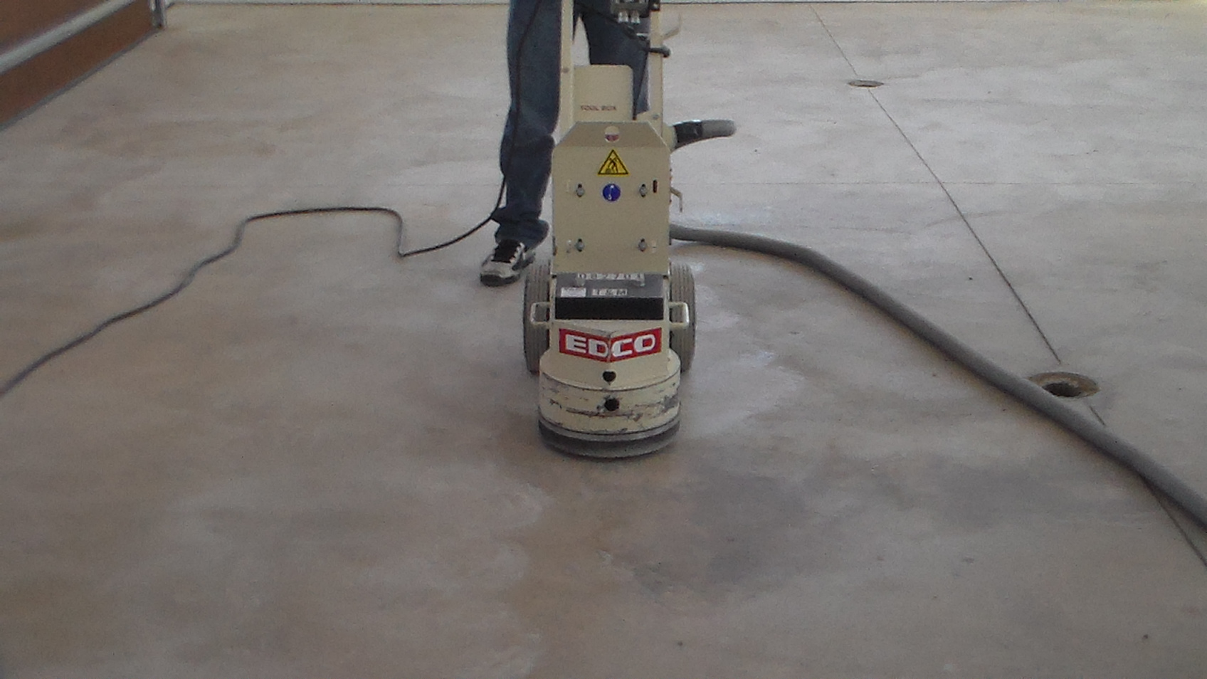 Grinding concrete floor.